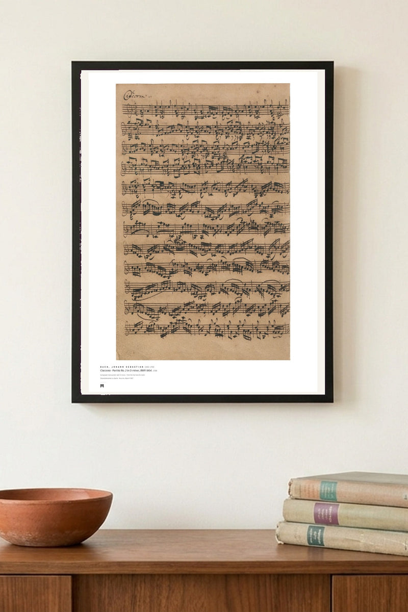 J. S. Bach — Ciaccona, Partita No. 2 in D minor (autograph) — Métrica art print, framed on a wall