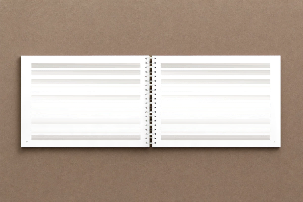 B A C H — open notebook, staff paper: two staves to a system, five systems to a page, ruled like Bach's, digitally composed product view