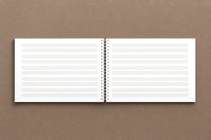 B A C H — open notebook, staff paper: two staves to a system, five systems to a page, ruled like Bach's, digitally composed product view