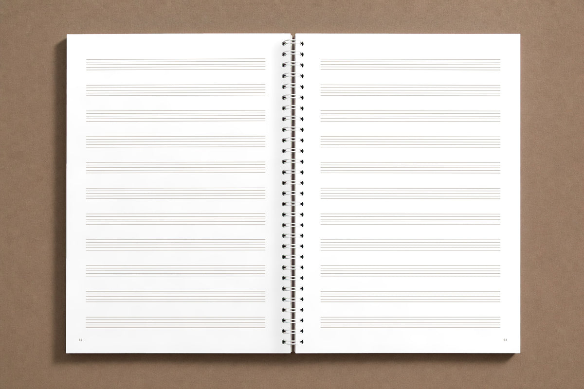 Senza Basso — open notebook, staff paper: staves the size of those in her copy, evenly spaced, digitally composed product view