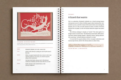 The Monitory Lizard — open notebook: the valentine on its leaf of the album, and the page that tells what it is, digitally composed product view