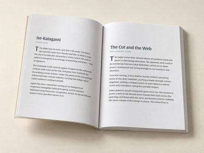 Katagami — Flying Fish — open notebook with the original editorial pages, digitally composed product view